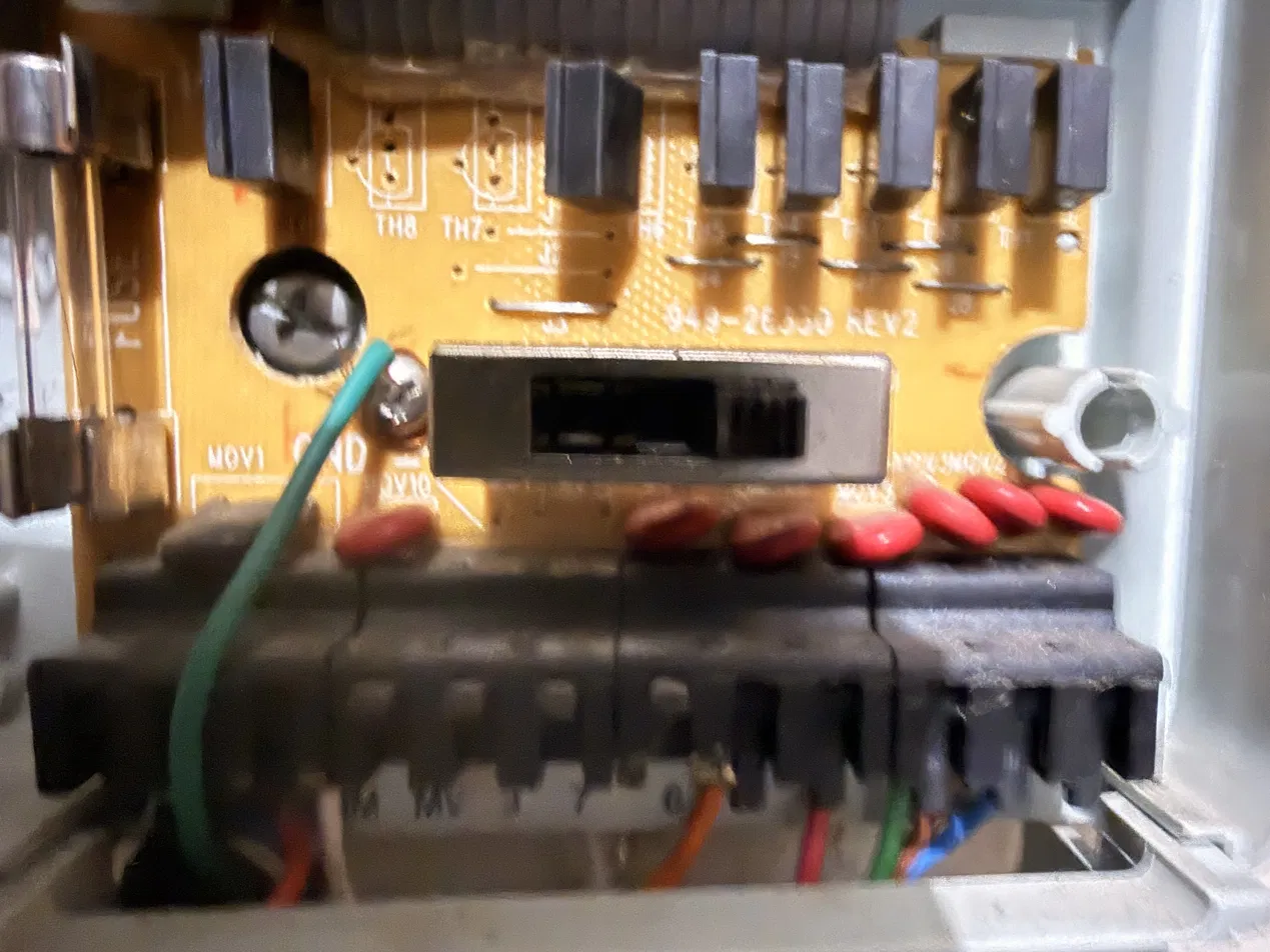 Power board showing station triacs TH1–TH8, red MOVs, a glass fuse and the field terminal block